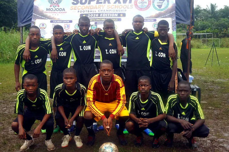 A team in black and lime kit posing before a match