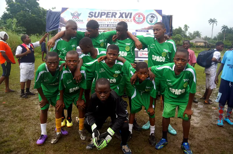 A team in green kit posing before a match at the Super XVI schools championship