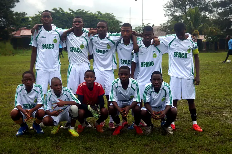 A team in white kit posing before a match